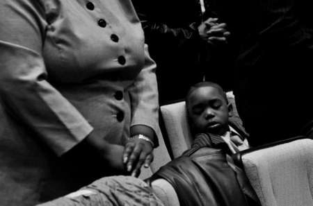Marcus Phillips, 6, sleeps during a Sunday service at Mount Zion Baptist Church.
