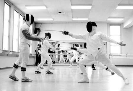 Man-Sum Lai, a first year graduate student in the fencing program, and Jeremy Taven, an instructor in arms candidate, practice their swordsmanship during a Saturday class at Washington Square Hall.