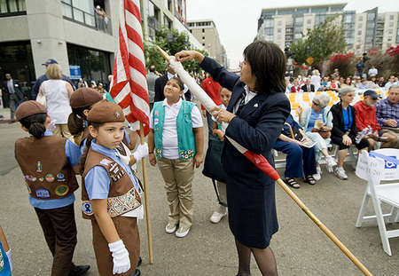 Irene Barajas, Girl Scout Leader of Group S912 San Ysidro, prepares the California flag for a "call of the guard" at the San Diego New Central Library groundbreaking ceremony in downtown San Diego. 