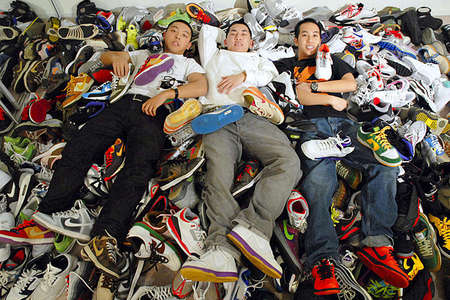 Jason Wong and his roommates, Aaron Chiang, center, and Adrian Lui, have 300 pairs of limited-edition sneakers among them, crammed into their San Jose two-bedroom apartment. Total spent over the years: nearly $30,000.