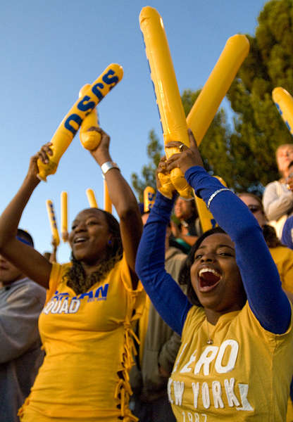 Students cheering at homecoming game.