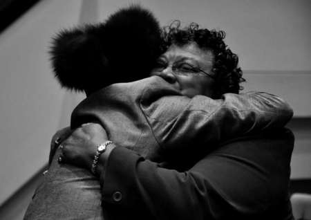 Marisha Jackson embraces a fellow church member after Sunday service has ended at Mount Zion Baptist Church.