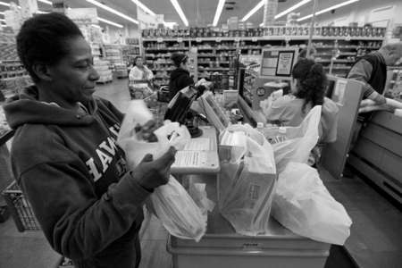 Denise buys groceries for her family with food stamps. The government places money electronically to a card every month. She says, "It's not enough to feed a family." She does not use all the stamps she receives on the card, instead she saves some of the stamps for needed purchases later on.