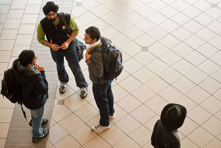 Students conversing at Engineering building before class starts.