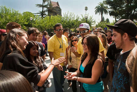 Students playing a game of rock, paper, scissors at the freshmen welcome orientation ceremony.