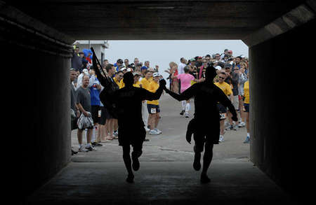 Racers at the Ragnar Relay race arriving at the finish line after a three day run that started in Huntington Beach and ended in Coronado.